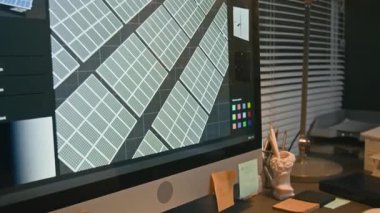 Hiç kimse, sürdürülebilir teknoloji ofisinde güneş paneli sistemi ve dijital çizim tableti tasarlamak için kullanılan CAD yazılımıyla bilgisayar monitörünün eğik görüntüsünü çekmez.