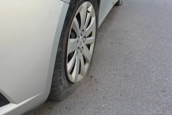 stock image Car with punctured flat tire parked on roadside