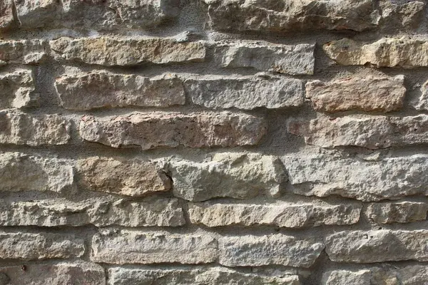 Cream and white brick texture background. Brick or stone floor interior rock old clean pattern uneven concrete grid bricks stacking design.