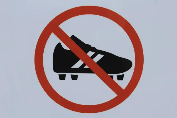 No high heels sign hanging in the park