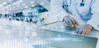 Blurred-Doctor with stethoscope,using laptop on table,with background,medical service network connection,online marketing business medical,digital modern healthcare,insurance,medical examination.