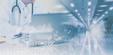 Blurred-Doctor with stethoscope,using laptop on table,with background,medical service network connection,online marketing business medical,digital modern healthcare,insurance,medical examination.