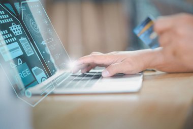 Futuristic concept online shopping,payment application 4.0 technology,businessman using laptop online shopping modern hologram virtual screen icon system connection process by artificial intelligence