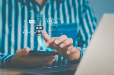 Business person using smartphone with holographic AI chatbot for customer service, symbolizing 24/7 digital support, secure communication, and intelligent agents in next-gen business technology.