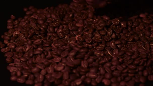 Man Pouring Coffee Beans His Hand Slow Motion Black Background — Stock Video