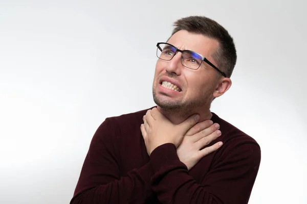 Handsome Man Glasses Isolated Background Touching Painful Neck Sore Throat — Stok fotoğraf