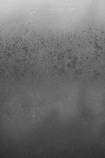 Morning condensation on the windows during the cooling period outside, the texture of condensation on the window.