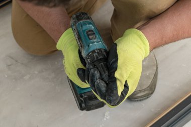 Drilling a hole in the door frame for a corner connection, installation of interior doors.