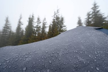 Vorokhta, Ukraine June 12, 2022 : Dew and raindrops on a Coleman tent, close-up of raindrops.