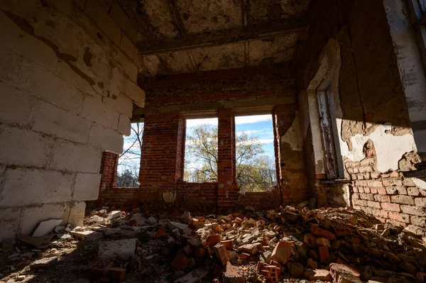 abandoned and destroyed offices and halls, a destroyed industrial building, a house with broken windows, rays of light in a destroyed room.