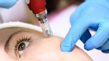 The process of rejuvenation and moisturizing with the help of the darsonval cosmetology device, the mesotherapy procedure.