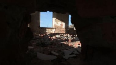 Hole in the brick wall, broken and destroyed industrial and industrial building, video 4k.