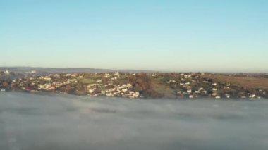 Drone flight over village with morning fog, panoramic view and panoramic 4k video, Ukrainian village at dawn.