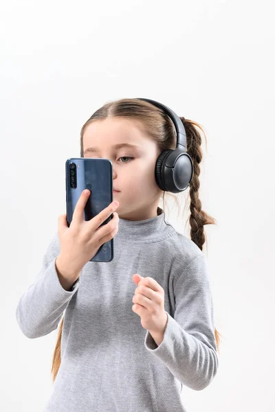 Girl Headphones Phone White Background Girl Pigtails Listens Music Headphones — Photo