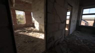 Broken brick building without windows and doors, broken windows and doors, empty window and door openings, industrial premises, video 4k.