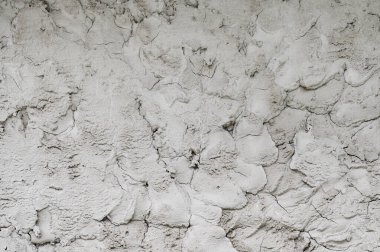 Gri çimento kum havanıyla dekore edilmiş eski bir duvarın arka planı