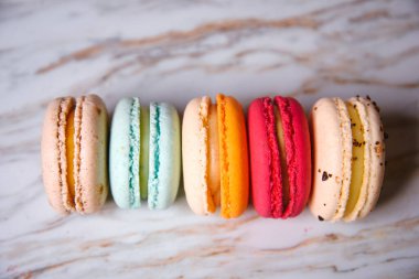 Macaron pink, orange and beige, blue on marble style. A beautifu
