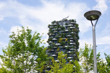Milan, Lombardy, Italy - MAY, 5, 2024: the Bosco Verticale skyscrapers, a modern example of vertical forest and sustainable architecture. clipart