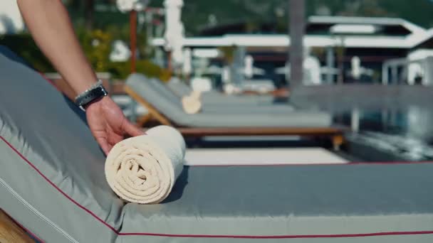 Slow Motion Close Man Laying Out Rolled Beige Towels Sun — Stock Video
