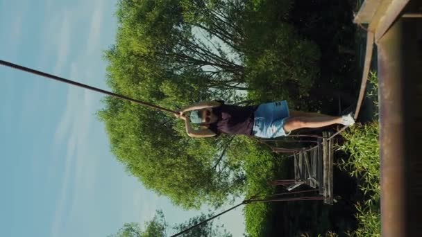 Vertical Dangerous Situation Woman Crossing Destroyed Suspension Rope Bridge — Stock Video