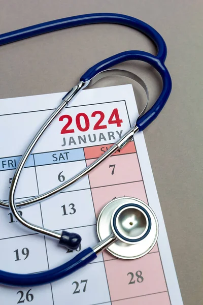 Medicine concept. Stethoscope on the background of the calendar for 2024.
