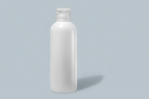 White off-brand bottle isolated on grey-blue background, cosmetic packaging mockup with a shadow.