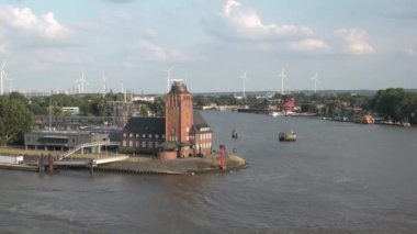 HAMBURG, GERMANY-JUNE, 2023: Gantry cranes in the seaport of Hamburg. Huge harbour cranes. Hamburg port with cranes and cargo ship. Container terminal. Transport industry. Logistics technologies. 4K