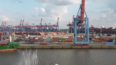 HAMBURG, GERMANY-JUNE, 2023: Gantry cranes in the seaport of Hamburg. Huge harbour cranes. Hamburg port with cranes and cargo ship. Container terminal. Transport industry. Logistics technologies. 4K