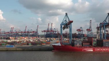 HAMBURG, GERMANY-JUNE, 2023: Gantry cranes in the seaport of Hamburg. Huge harbour cranes. Hamburg port with cranes and cargo ship. Container terminal. Transport industry. Logistics technologies. 4K