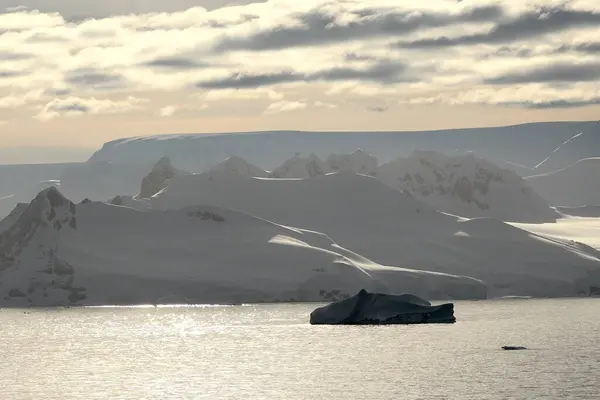 Arctic landscape. Icebergs and global warming. Arctic glacier. Polar Region Antarctica, Climate Change. Ice rapidly melting. Human activities impact on environment, global climate crisis. 4K