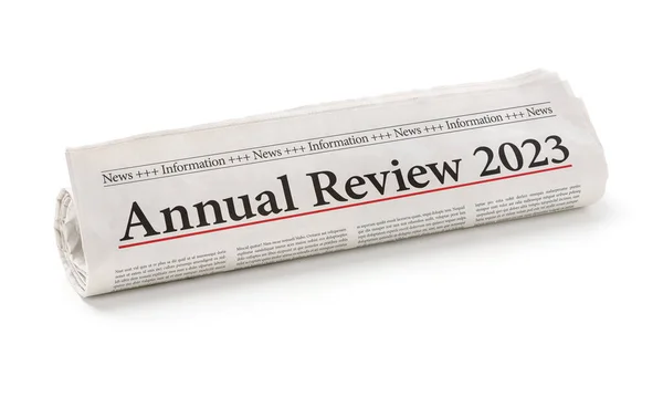 Rolled Newspaper Headline Annual Review 2023 Stock Picture