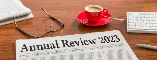 Newspaper Wooden Desk Annual Review 2023 Stock Photo