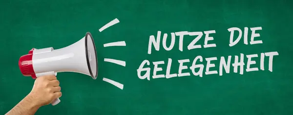 A man holding a megaphone - Take the opportunity  in german - Nutze die Gelegenheit