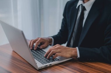 Businessman using laptop computer in office smart technology clipart