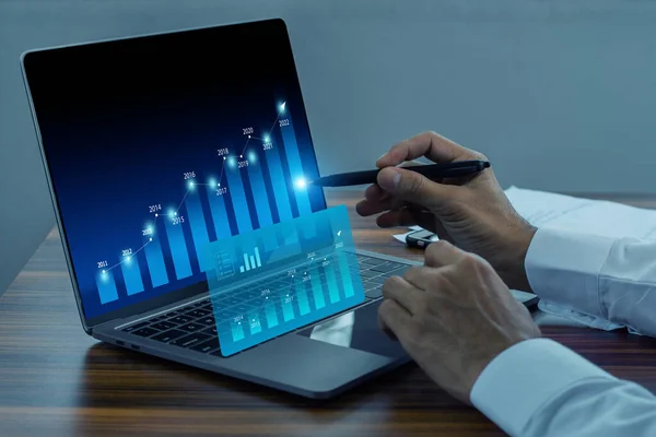 Businessman using computer trading online  digital graph on technology visual screen for trading online stock market forex or stock exchange