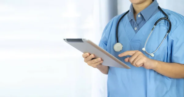 Doctor holding tablet Healthcare And Medicine concept. Doctor, Nurse