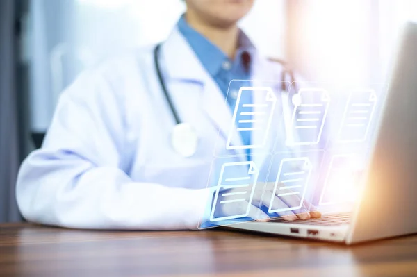 stock image Doctor using computer Document Management System (DMS), online documentation database process automation to efficiently manage files