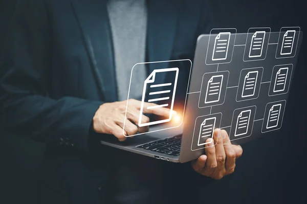 Businessman using computer Document Management System (DMS), online documentation database process automation to efficiently manage files, Documents Management  concept