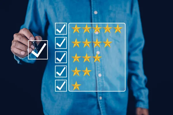 Customer review concept, Increase rating, evaluation and classification concept. Businessman draw five yellow star to increase rating of his company.