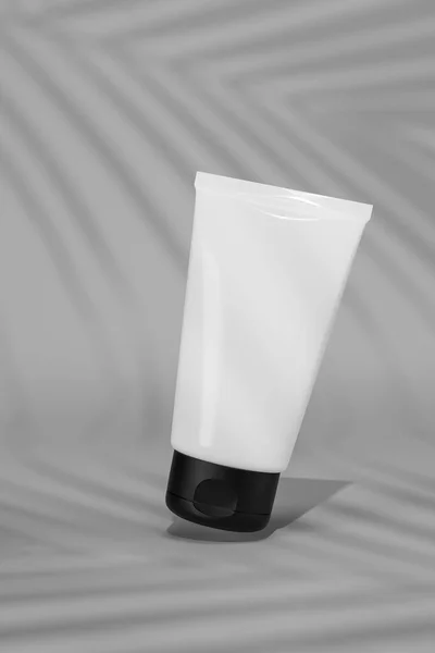 3d rendering A white tube of cosmetics green color background. The concept of natural cosmetics. Mockup.