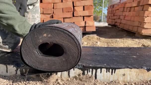 Roll Waterproofing Foundation Building Start Laying Walls Gas Block Brick — Stock Video