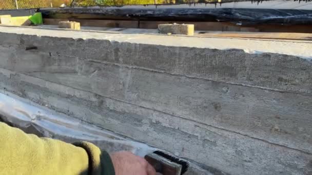 Builder Applies Bituminous Primer Top Concrete Foundation Further Wall Laying — Stock Video