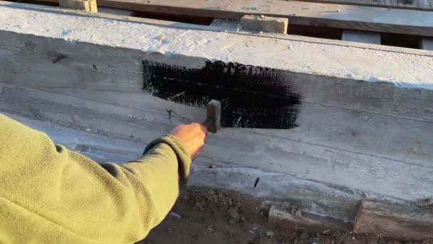 Builder Applies Bituminous Primer Top Concrete Foundation Further Wall Laying — Stock Video