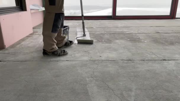 Construction Works Video Footage Priming Floor Surface Further Finishing Work — Wideo stockowe