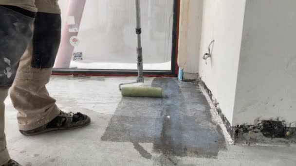 Construction Works Video Footage Priming Floor Surface Further Finishing Work — Stock video