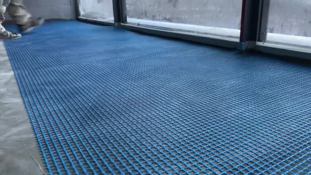 Video Footage Laying Reinforcing Nylon Mesh Floor Construction Works — Video Stock