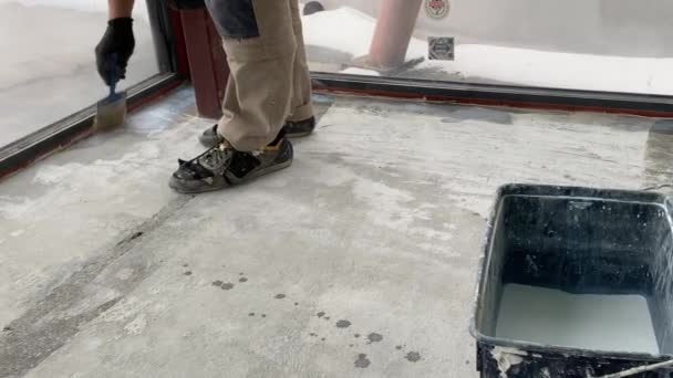 Construction Works Video Footage Priming Floor Surface Further Finishing Work — Stockvideo