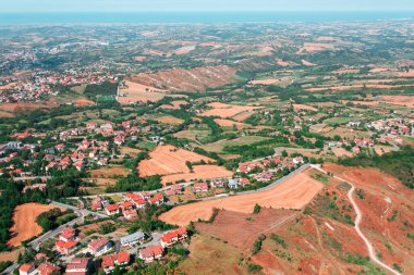 Panoramic view from the fortress of San Marino to the village at the bottom of the mountain, a separate state of San Marino, Italy