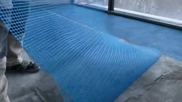 Video Footage Laying Reinforcing Nylon Mesh Floor Construction Works — Stockvideo