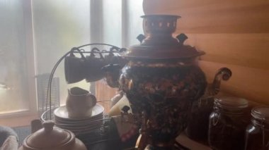 Boiling a samovar in a sauna, a bath for making fragrant herbal tea. Traditional tea after steaming in the sauna